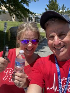 Dr. Cynthia Tucker, a CLMS Grade 7 parent volunteer pictured with Jay Gionet at one of the three water stations