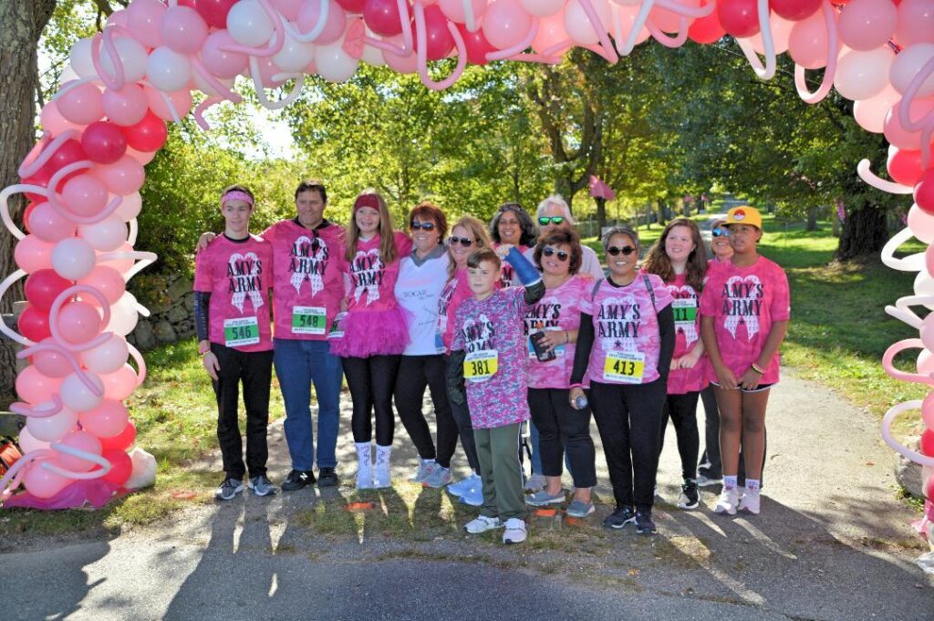 Amy's Army which includes other breast cancer survivors at the 2021 Walk for a Cure finish line.